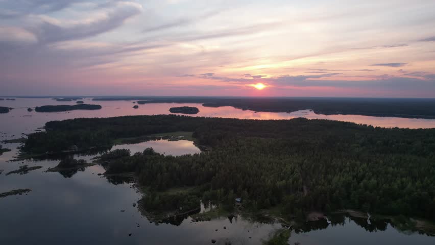 Aerial view to a sunset in the Finnish archipelago in the Baltic Sea Royalty-Free Stock Footage #3415822385