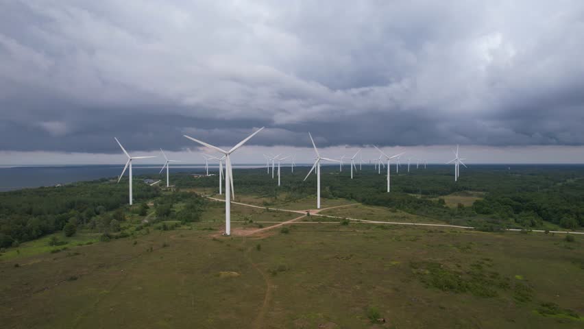 Wind turbines in Estonia seen in an aeriald drone video Royalty-Free Stock Footage #3415830381