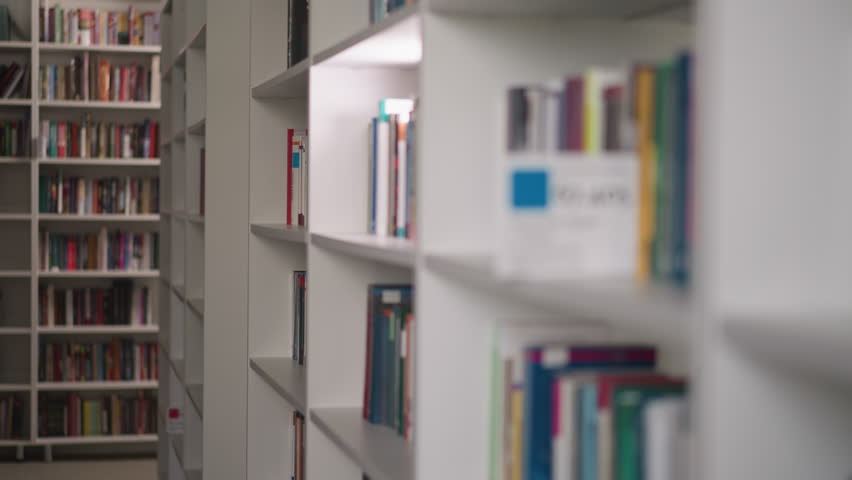 Public literature storage with various books. Shelves filled with educational literature for university students. Dedication to knowledge acquisition