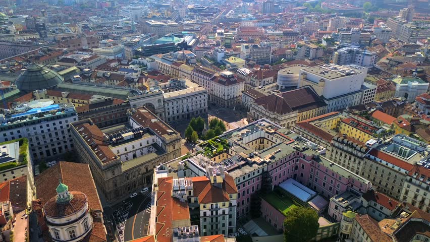 Aerial view of the Old Square with a monument to the artist and inventor Leonardo da Vinci next to the La Scala opera house theatre. Vittorio Emmanuele gallery in Milan Italy 2024