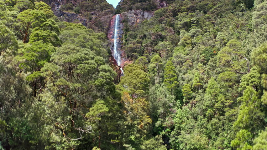 Scenic waterfall beautiful nature of Tasmania Australia. Aerial view Royalty-Free Stock Footage #3416103333