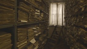 Old archival documents. A collection of paper cards and pages with historical data. Museum value of collections. The collection contains files and source files. Calm and slow footage shot in a cinemat