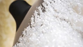 Close-up of a beaded and sequined fabric
Detail of a bridal gown with delicate pearls
Blurry background with a hint of yellow
Luxurious texture of a wedding dress
Sparkling and intricate embroidery - Powered by Shutterstock - Get 15% off with code: PIKWIZARD15