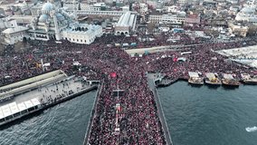 Aerial footage of support rally for Palestine and Gaza. They gathered in Istanbul to support Gaza. People gathered to help Gaza. Palestinian flag.
