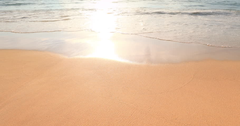 Pristine beach front with peaceful waves washing clean sea sand