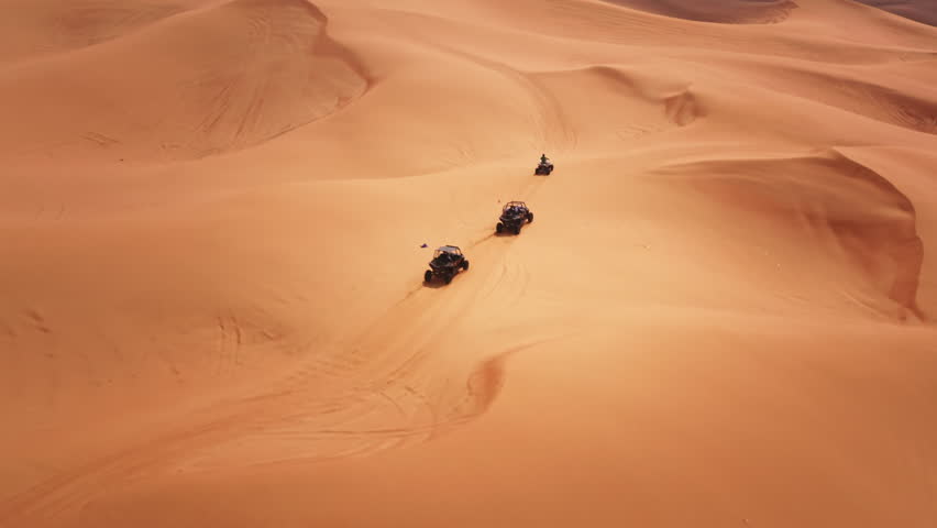 Dune buggy tour in Dubai desert UAE, aerial drone view Royalty-Free Stock Footage #3416207661