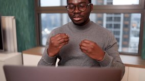 African man having an online meeting