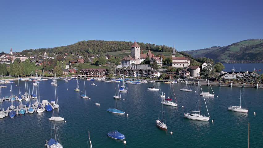 Aerial panorama of Spiez old town, castle and vineyards, Lake Thun, Switzerland.
