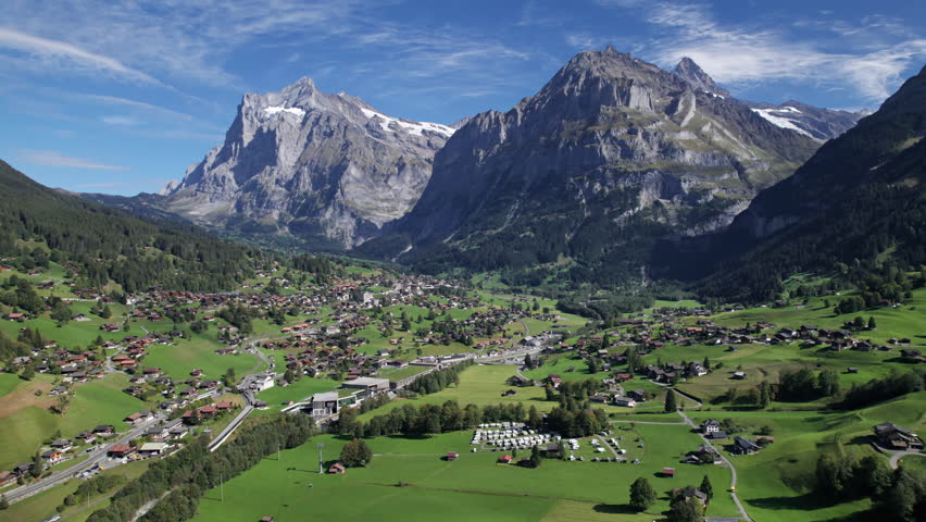 Aerial view of Grindelwald mountain village, Bernese Oberland, Switzerland. 2.5x speeded up from 24 fps. Royalty-Free Stock Footage #3416464343