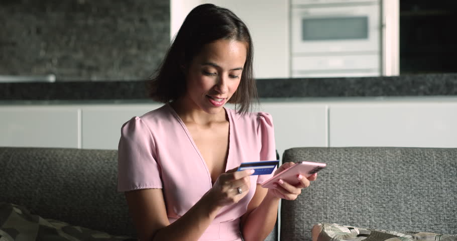 Debit card fraud, data breaches, identity theft. Woman try to pay through e-banking app, faced up with problem, hold card, enter data feels stressed due to scam or lack of money unsuccessful e-payment Royalty-Free Stock Footage #3416501359