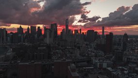Fire on the Sky, Establishing Aerial View Shot of New York City NY, NYC, United States, Downtown Manhattan, One World Trade Center, Wall Street, New York Stock Exchange, Woolworth Building