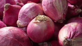 Dive into the hidden world of red shallots through this macro footage, where every detail, from their delicate skin to vibrant red, reveals nature's enchanting secrets. 4K.
