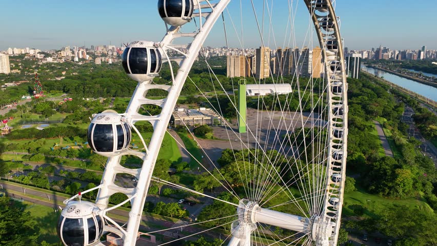 Ferris Wheel At Candido Portinari Park Sao Paulo Brazil. Ferris Ride. Business Sky Clouds Downtown Cityscape. Business Drone View Downtown Establishing Shots Panoramic.