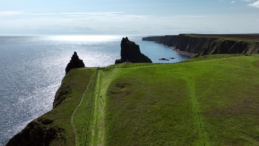 Circular drone shot showing the Duncansby stacks at the most northerly point of Scotland.