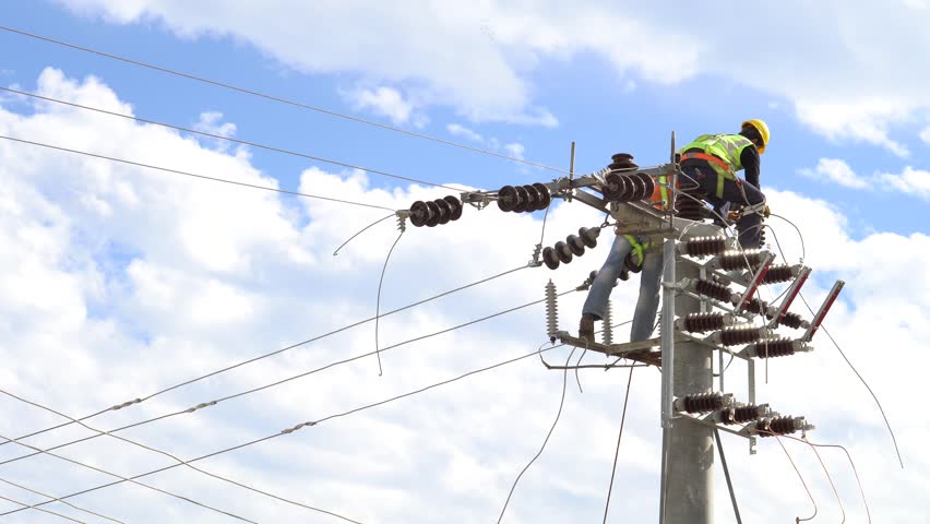 men working on a transformer on a electricity power pole Royalty-Free Stock Footage #34169266
