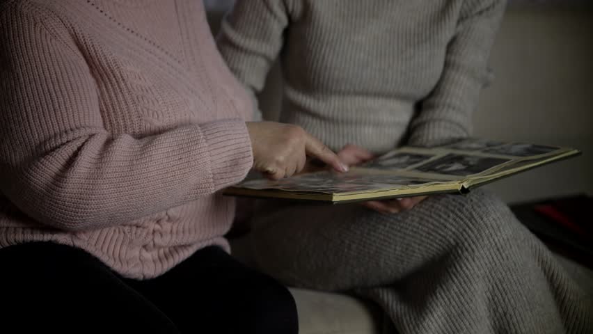 Family Album Photo. Home Vintage Photos Album Photobook Past Event. Woman Having Fun Looking Life Memories Old Photo Album Nostalgic Memory At Elderly Time. Family Entertainment Recalls Past Biography