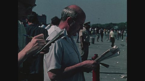 NEW YORK, 1971, Aqueduct Race Track in Queens, close up of men with racing forms