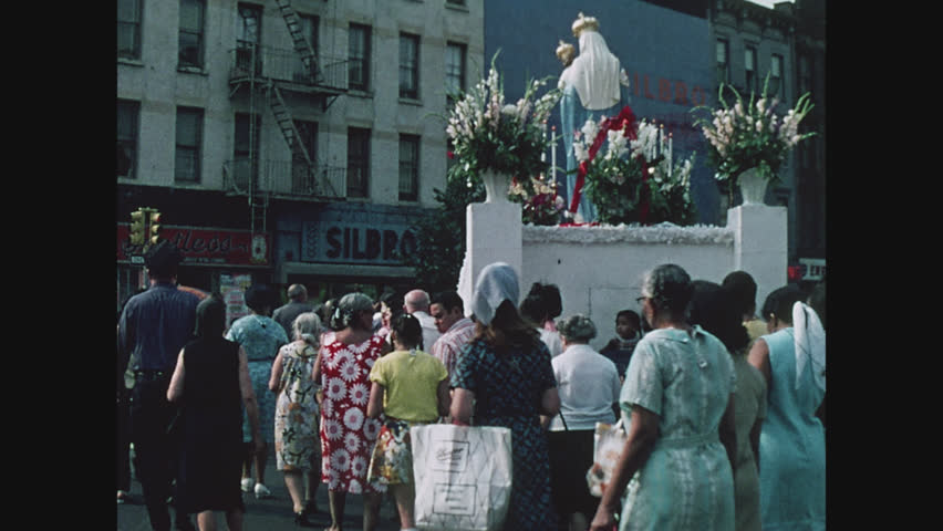 NEW YORK, 1971, Italian religious festival parade in East Harlem, crowd of Italian women following the float