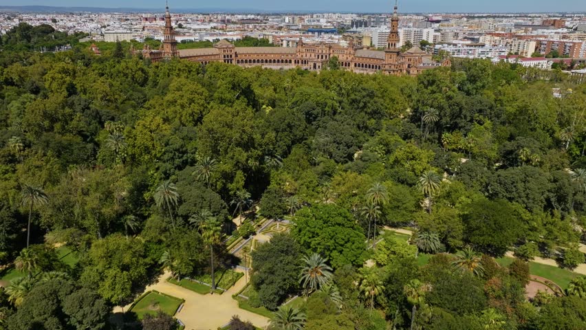 Flying Over The Parque de Maria Luisa To The Plaza de España In Seville, Spain. - aerial shot Royalty-Free Stock Footage #3417185379