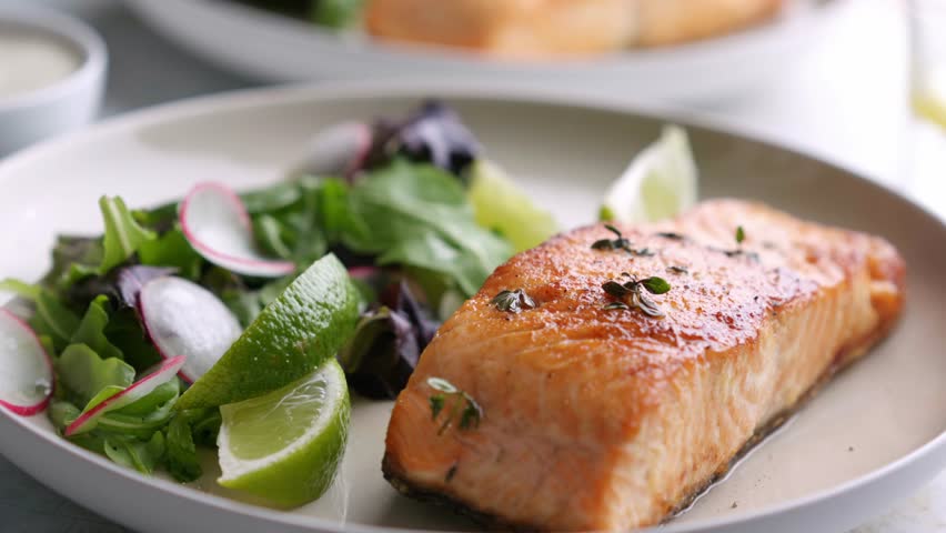 Grilled salmon fillet and fresh vegetable salad. Mediterranean diet. 