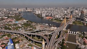 Aerial drone video of multilevel junction highway crossing with high speed motorway