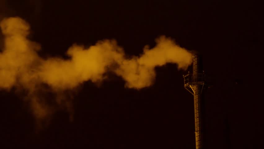 Close up. Emissions to the atmosphere. industrial pipes. Night