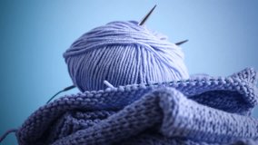 Set for hand knitting, blue yarn, knitting needles.