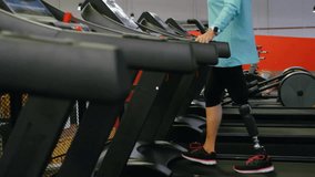 Animation of network of people icons over caucasian woman with prosthetic leg in vr headset at gym. Networks, digital interface, fitness, disability and communication, digitally generated video. - Powered by Shutterstock - Get 15% off with code: PIKWIZARD15