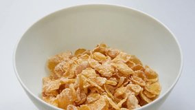 Corn flakes fall into bowl. Slow motion.stock video