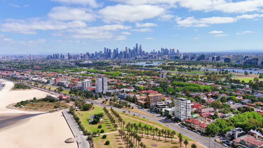 Melbourne, Australia: Aerial view of Albert Park with Albert Park Lake and famous Golf Course in capital city of Victoria, skyscraper skyline of Melbourne central business district (CBD) in background