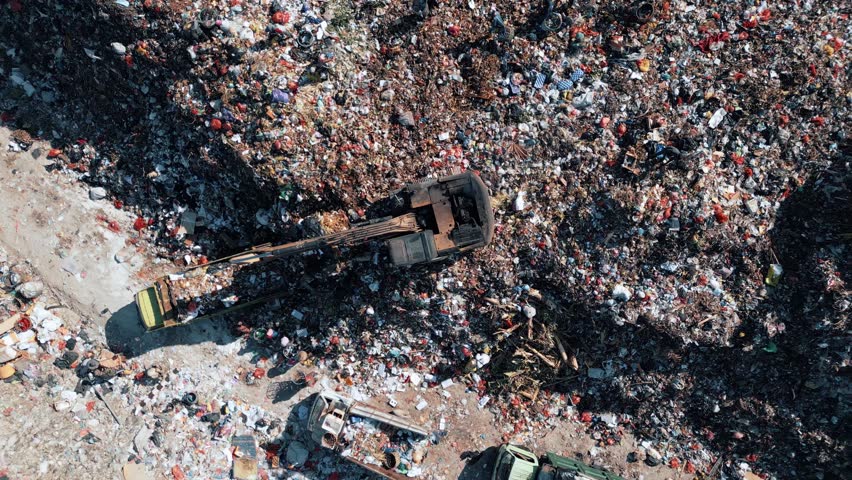 Damage Pollution Concept of Ecosystem Land. Big Waste Dump and Trash Truck with Garbage in Aerial Top View. Large Rubbish Landfill with Heaps Dirt Refuse. Factory with Bulldozer Machine and Workers 4k Royalty-Free Stock Footage #3417765277