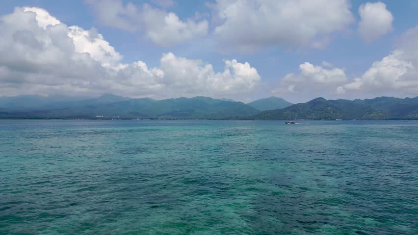 Aerial View on Boat Traveling in Blue Water of Atlantic Ocean. Concept of Modern Ship at Fish Season in Indian Sea Nature. Explorational Cruise or Fun Journey of People Swimming in Sailboat Outside 4k