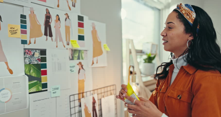 Fashion designer, woman planning and creative ideas on wall or moodboard with sticky note for goals or sketch. Young artist with clothes production, startup project or inspiration for color palette Royalty-Free Stock Footage #3417793611