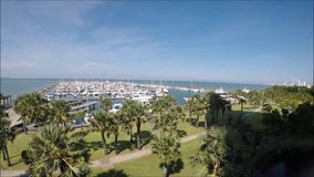Footage HD wide angle of yatch club with beautiful blue sky and sea from above.