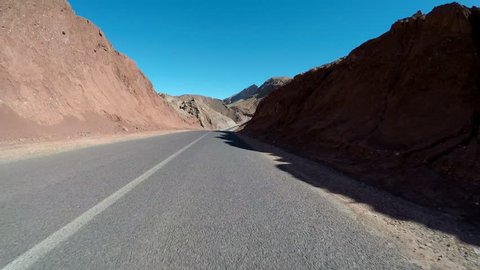 POV Driving through Morocco in desert Atlas Mountains landscape – super steady shot in 4K