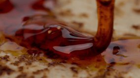 Close up of pancake with pouring syrup rotating food background - Powered by Shutterstock - Get 15% off with code: PIKWIZARD15