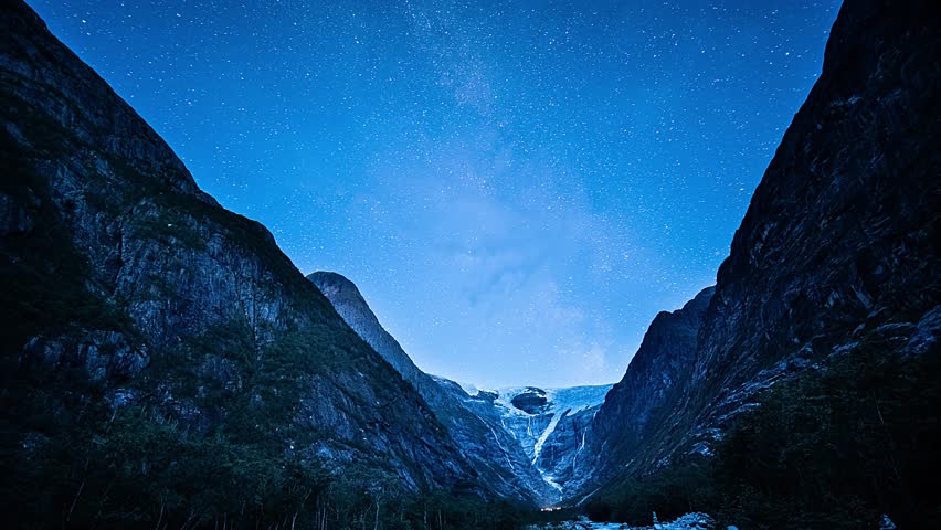 An awe-inspiring view of the night sky above the Kjenndalsbreen glacier. A night timelapse video.