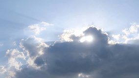 Sun light ray n lens flare or bokeh sunlight shining through dark rain storm cloud or cumulus cloudscap on bright blue sky in tropical summer daylight sunshine day, 4k slow n stop motion TimeLapse - Powered by Shutterstock - Get 15% off with code: PIKWIZARD15