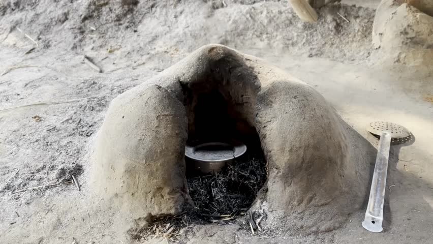 Indian traditional Chulha its used for cooking. It creates yellow flame and smoke while burning. Indian traditional cooking stove like Indian Chulha Royalty-Free Stock Footage #3418112057
