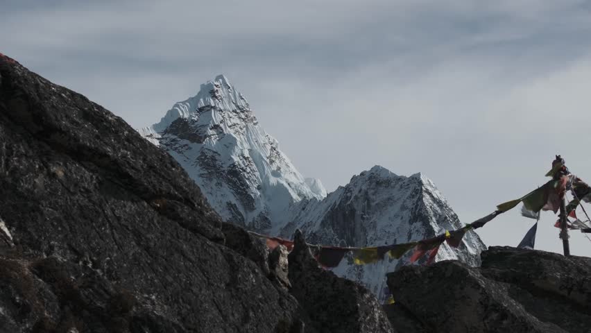 Aerial view of prayer flags and epic Himalayan mountains in Nepal
