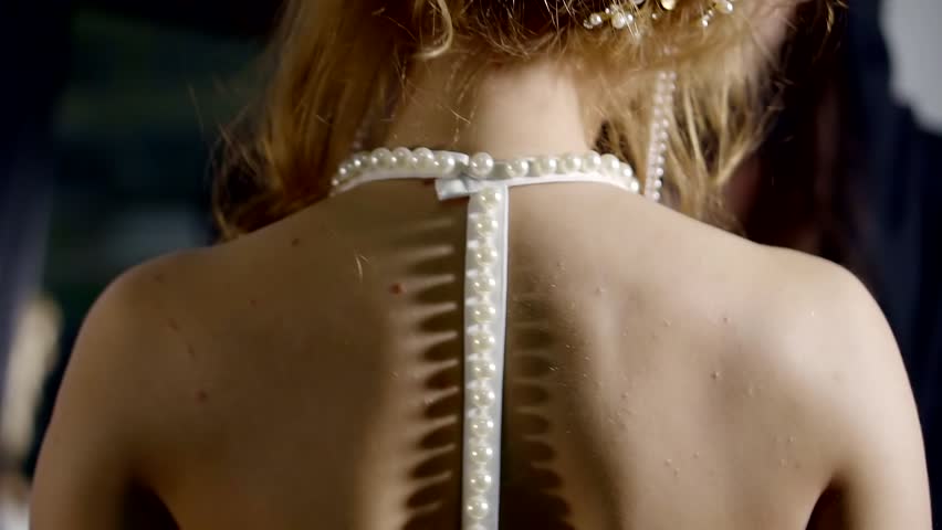 Young handsome man is trying new perfume.