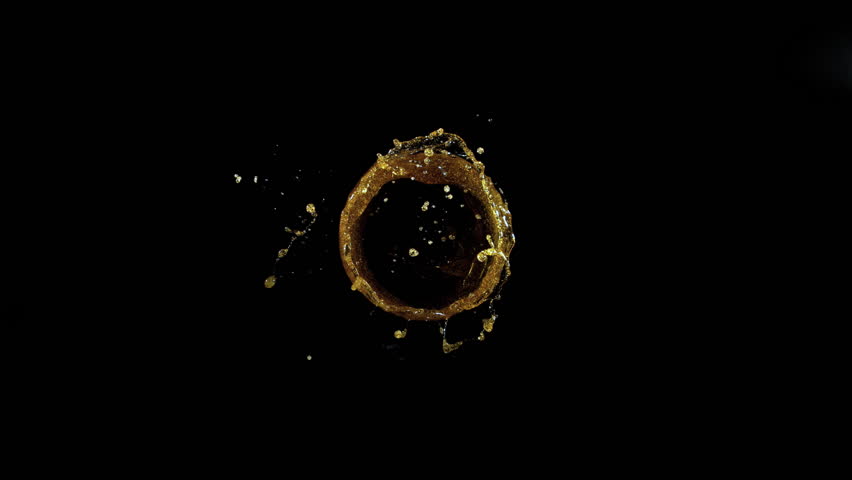 Super Slow Motion Shot of Oil Vortex Splash Liquid Isolated on Black Background at 1000fps.