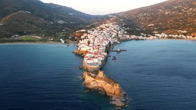 Aerial view video of iconic Andros island chora, Cyclades, Greece at dusk