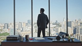 Manager silhouette contemplating city in panoramic office rear view. Calm company ceo in suit thinking looking window alone. Successful professional silhouette dreaming pondering future at workplace. - Powered by Shutterstock - Get 15% off with code: PIKWIZARD15