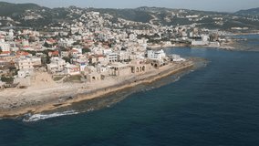 Establishing footage of Batroun, a coastal Mediterranean town and popular touristic place located in the north of Lebanon. Aerial video.