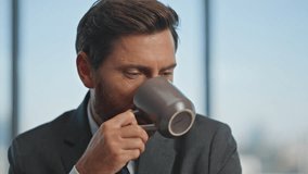 Smiling worker drinking coffee resting at desk. Closeup man hands typing laptop working in morning. Happy calm manager enjoying break sipping beverage. Middle aged businessman boss browsing computer - Powered by Shutterstock - Get 15% off with code: PIKWIZARD15