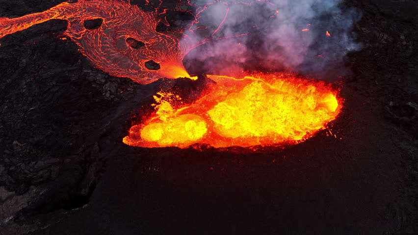 Volcano eruption, branching lava stream. Crater of active volcano. Iceland. - Powered by Shutterstock - Get 15% off with code: PIKWIZARD15