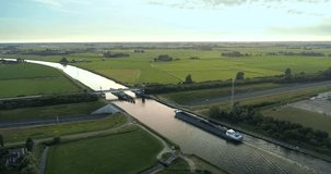 Cargo Ship Crossing Aqueduct and Highway - Grou, Friesland, The Netherlands, 4K Drone Footage