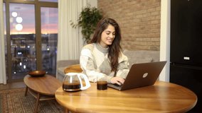 Woman enjoying her online work at home