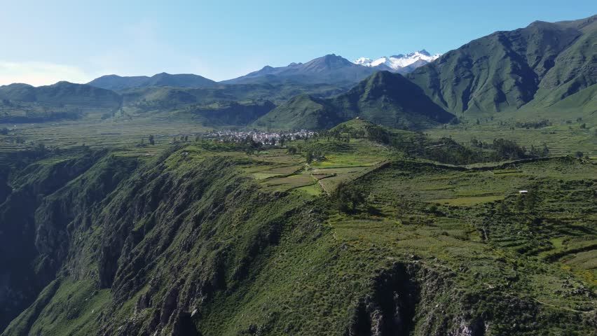 Colca Canyon, Peru: Aerial drone footage of the Cabanaconde town at the edge of the Colca Canyon in the Andes mountains in Peru in south America